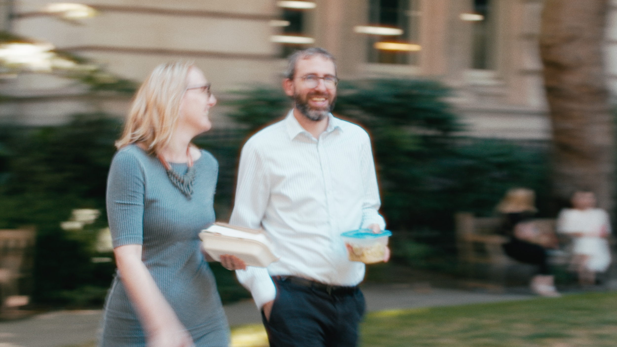 Commuters walking to lunch in Postman's Park, grainy film still