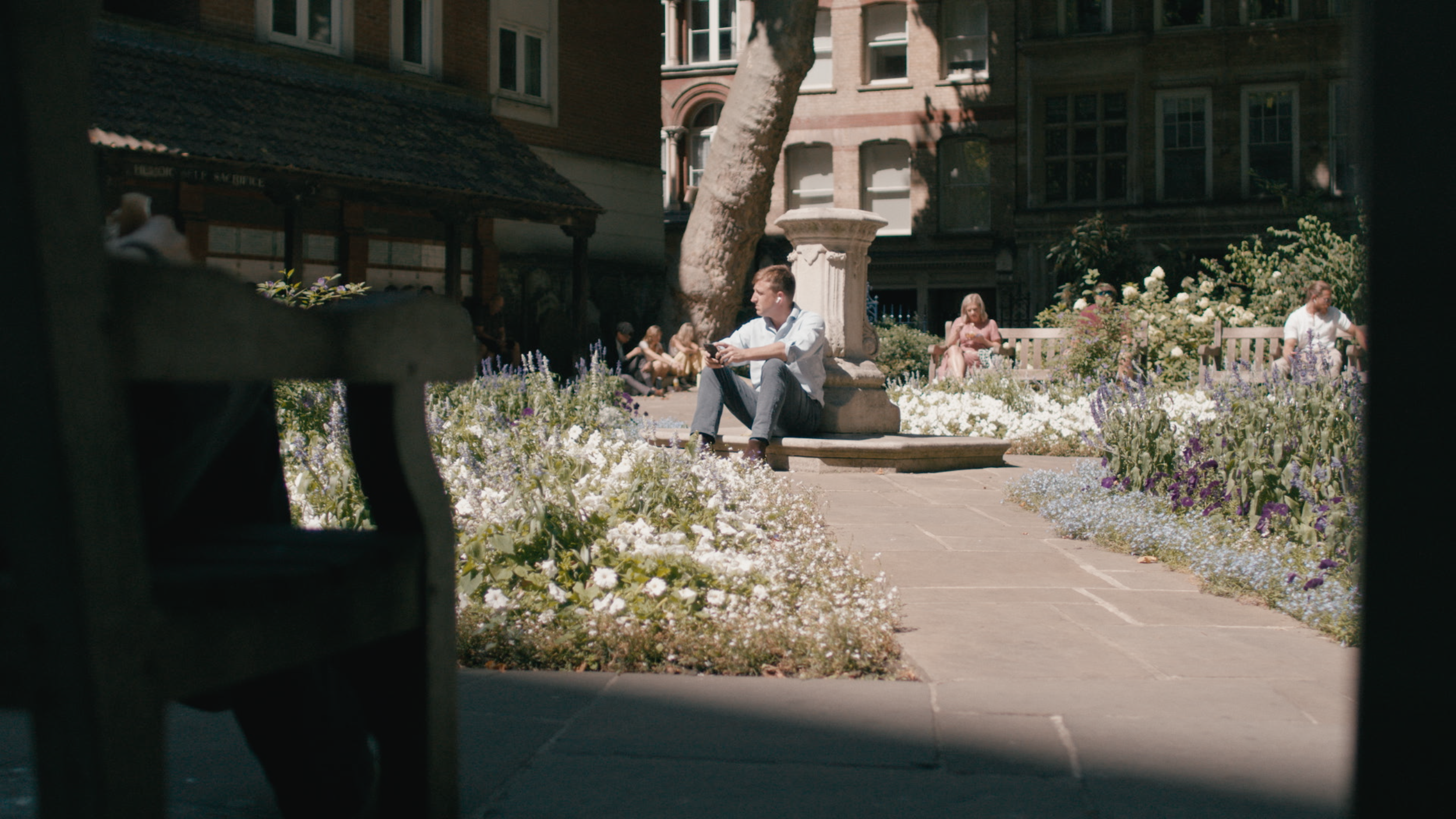 Commuter taking lunch break in Postman's Park
